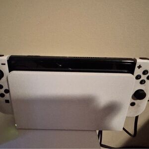 Portable White Gaming Console with Integrated Controls